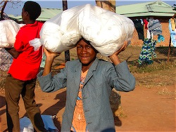 Youth carries supplies for hospital.